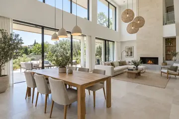 Double-height living room with a fireplace